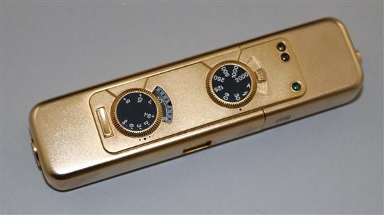 A Minox LX gold plated camera No.232/999 with original paperwork and box
